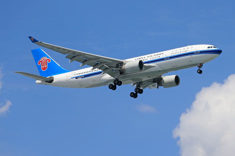 China Southern Airlines Airbus A330 flying against clear blue sky.